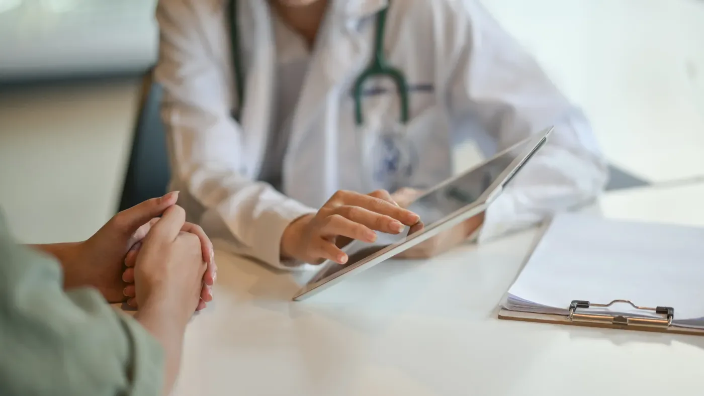 A physician reviewing a treatment plan with a patient